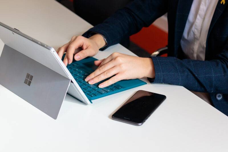 A person working on a laptop.