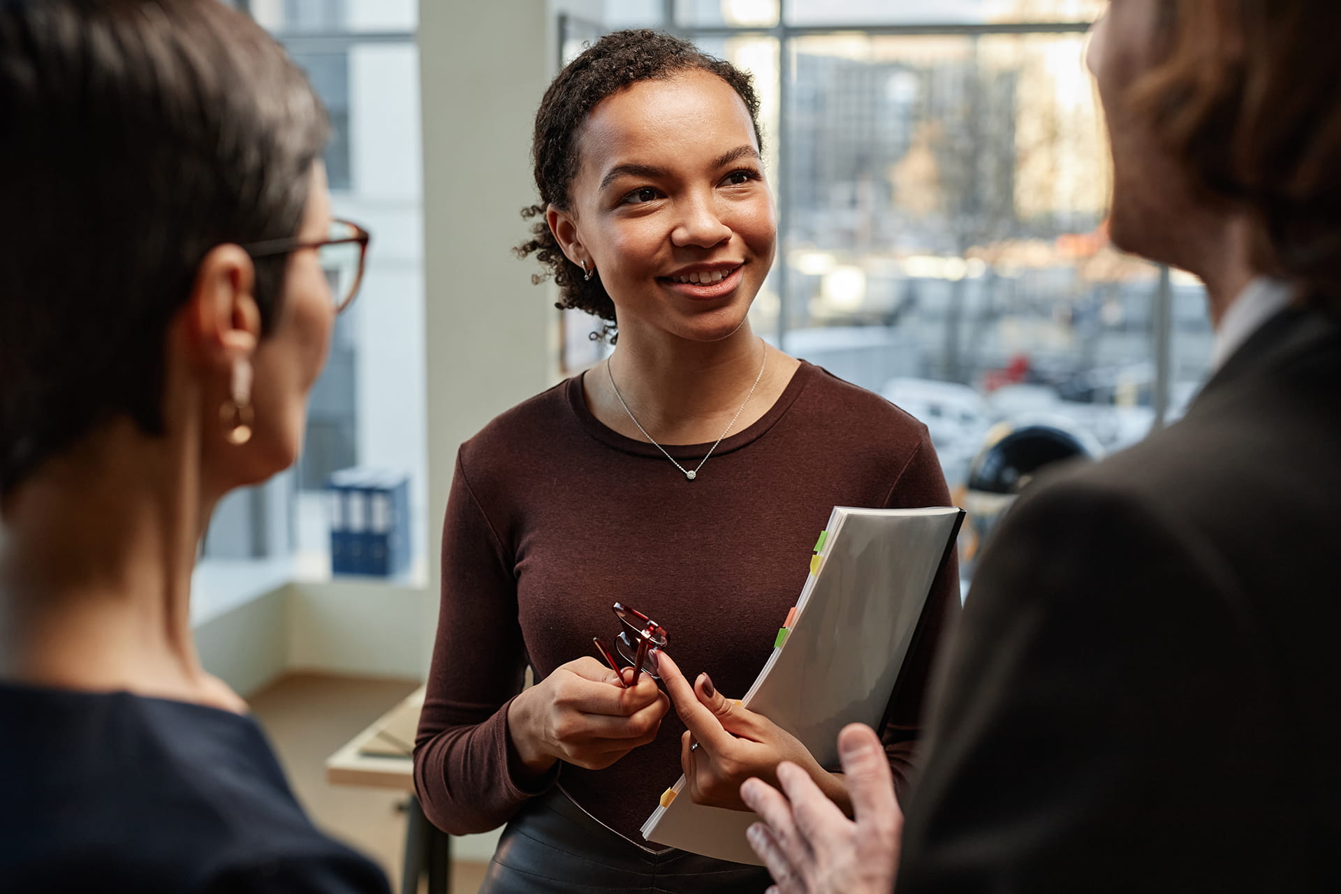 https://www.airit.co.uk/wp-content/uploads/2026/05/young-businesswoman-talking-to-colleagues.jpg